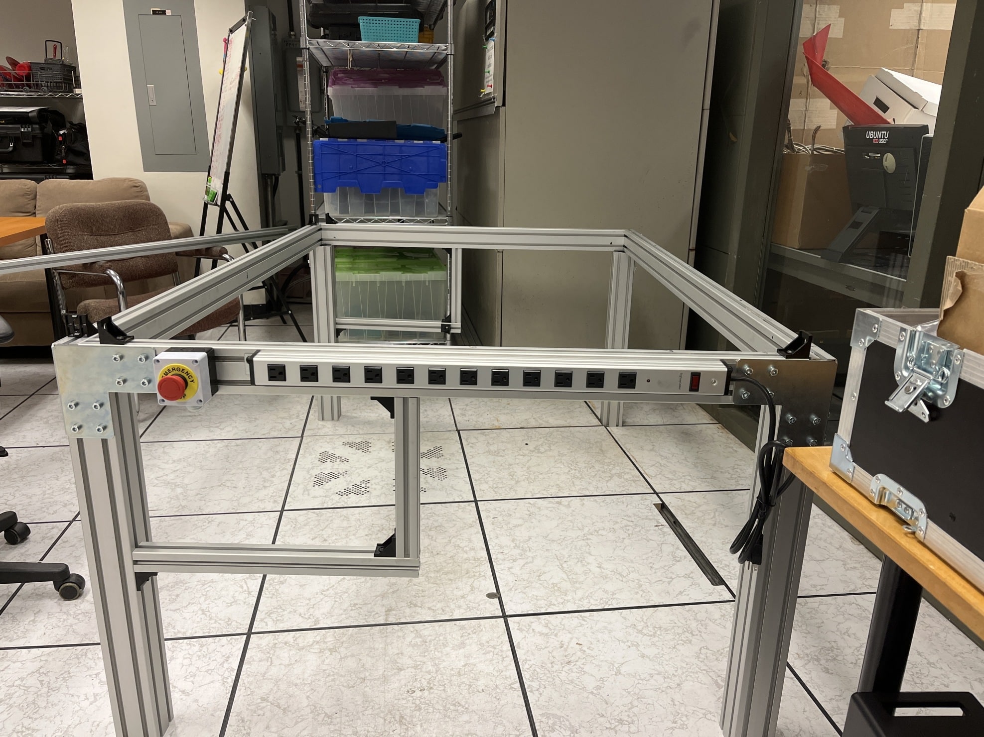 Emergency kill switch and power extension mounted on frame